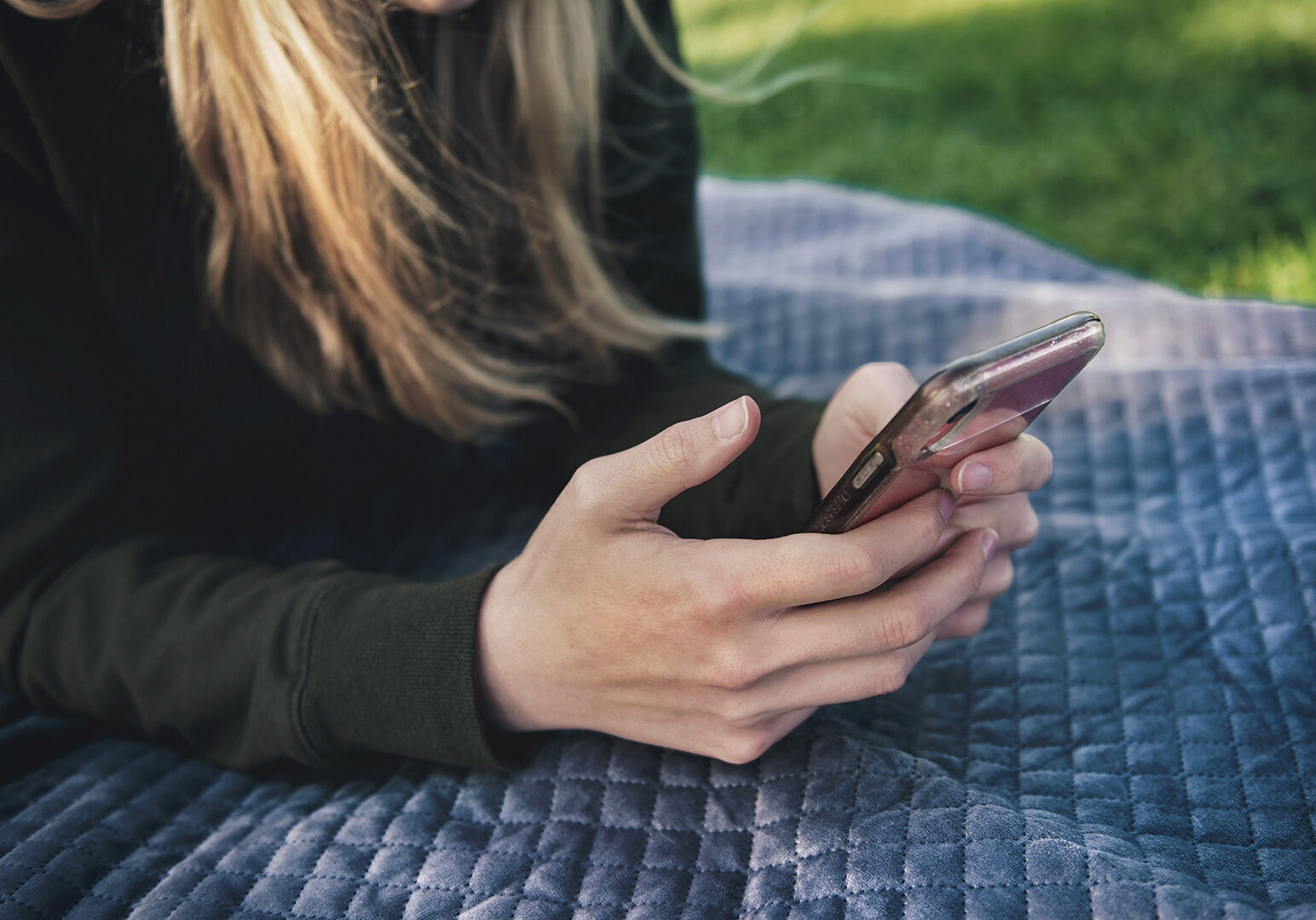 woman-holding-phone-outside