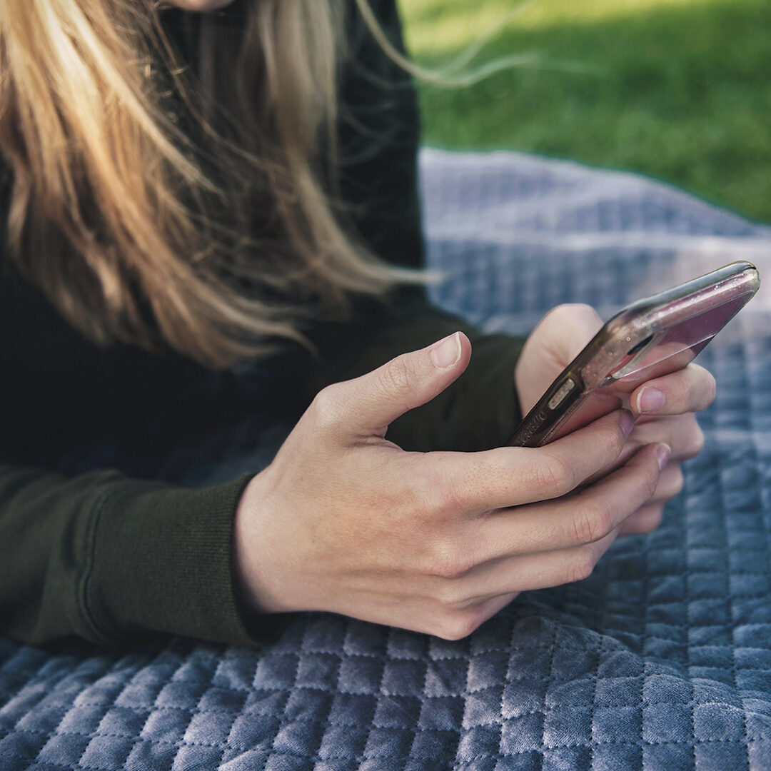 woman-holding-phone-outside